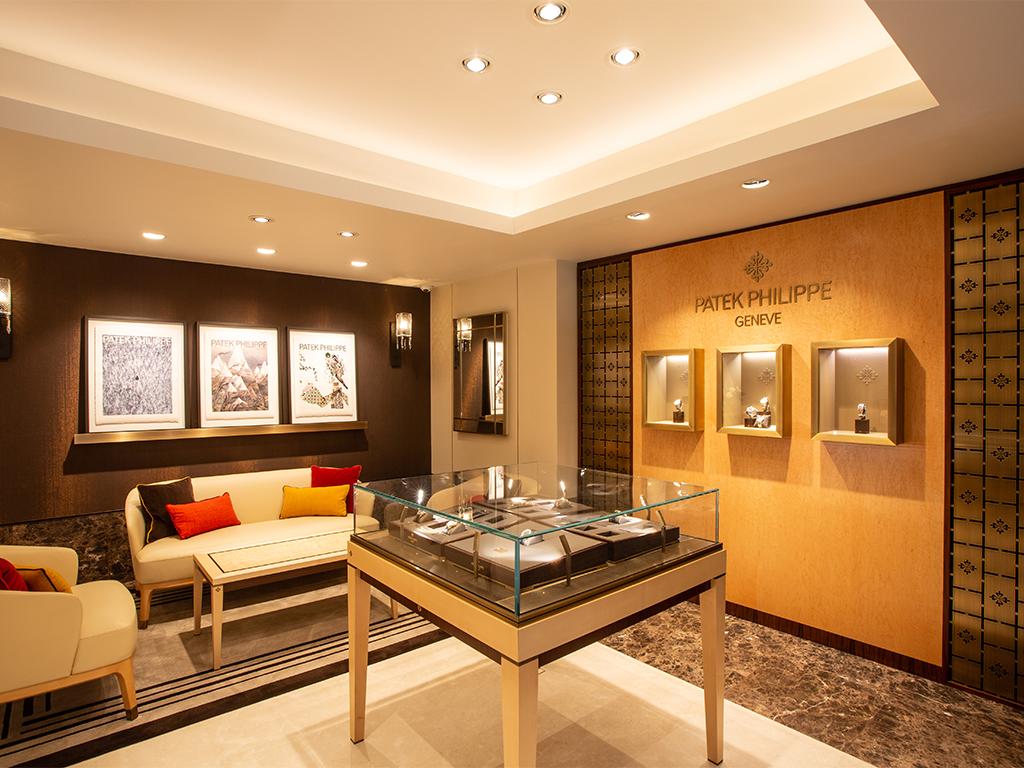 The Patek Philippe showroom at Michael Spiers. Several Patek Philippe watches are visible in glass cases.