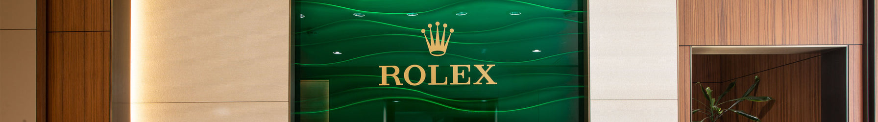 The Rolex logo that is visible on the wall of a Michael Spiers showroom