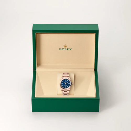 Rolex Oyster Perpetual 34 in 18 ct Everose gold with a Blue stone dial, Domed bezel, Oyster, three-piece solid links bracelet