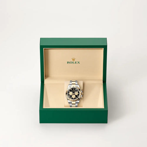 Rolex Cosmograph Daytona in Yellow Rolesor - combination of Oystersteel and yellow gold with a Bright black and golden set with diamonds dial, Fixed, with engraved tachymetric scale, in yellow gold bezel, Oyster, three-piece solid links bracelet