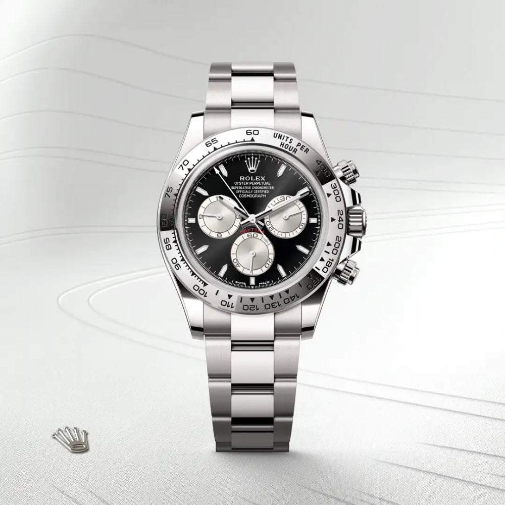 Rolex Cosmograph Daytona in 18 ct white gold with a Bright black and steel dial, Fixed, with engraved tachymetric scale, in 18 ct white gold bezel, Oyster, three-piece solid links bracelet