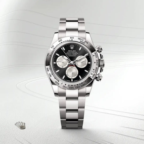 Rolex Cosmograph Daytona in 18 ct white gold with a Bright black and steel dial, Fixed, with engraved tachymetric scale, in 18 ct white gold bezel, Oyster, three-piece solid links bracelet