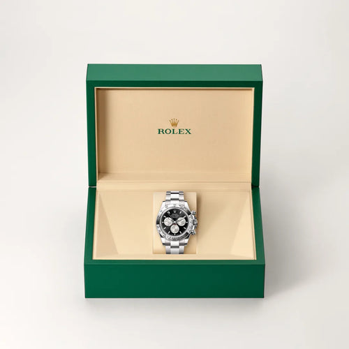 Rolex Cosmograph Daytona in 18 ct white gold with a Bright black and steel dial, Fixed, with engraved tachymetric scale, in 18 ct white gold bezel, Oyster, three-piece solid links bracelet