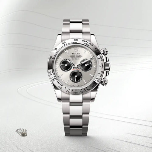 Rolex Cosmograph Daytona in 18 ct white gold with a Steel and bright black dial, Fixed, with engraved tachymetric scale, in 18 ct white gold bezel, Oyster, three-piece solid links bracelet