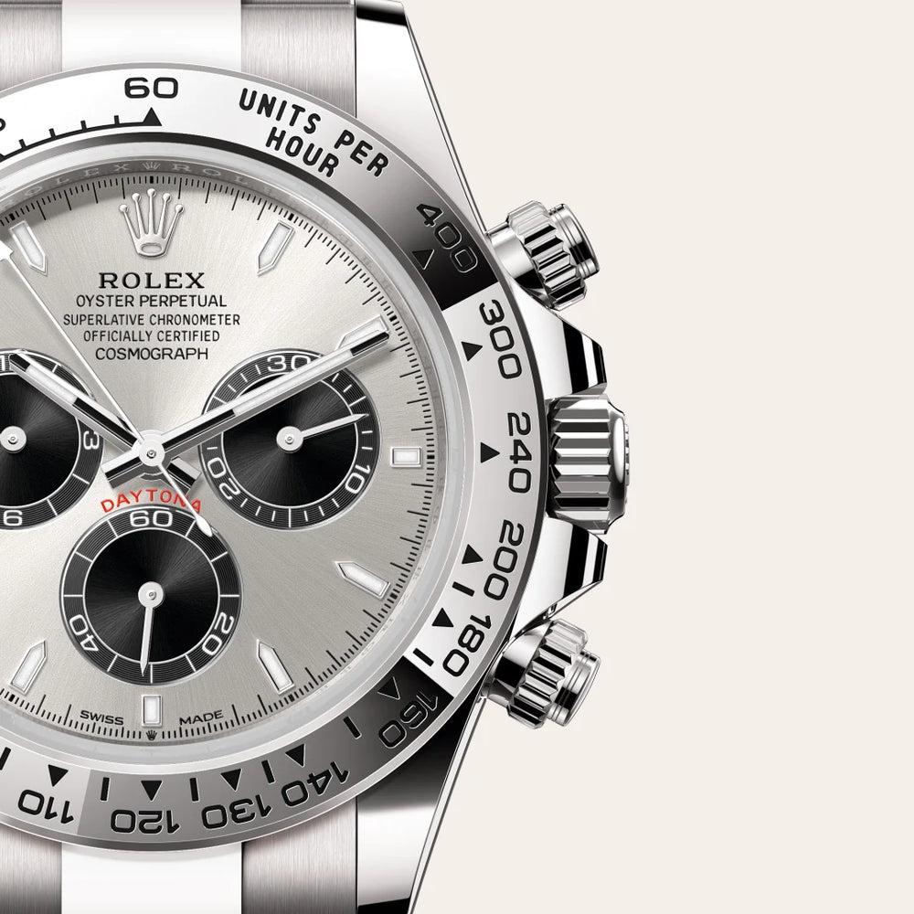 Rolex Cosmograph Daytona in 18 ct white gold with a Steel and bright black dial, Fixed, with engraved tachymetric scale, in 18 ct white gold bezel, Oyster, three-piece solid links bracelet