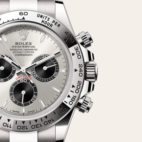 Rolex Cosmograph Daytona in 18 ct white gold with a Steel and bright black dial, Fixed, with engraved tachymetric scale, in 18 ct white gold bezel, Oyster, three-piece solid links bracelet