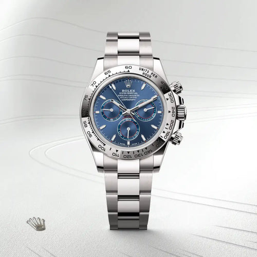 Rolex Cosmograph Daytona in 18 ct white gold with a Bright blue dial, Fixed, with engraved tachymetric scale, in 18 ct white gold bezel, Oyster, three-piece solid links bracelet