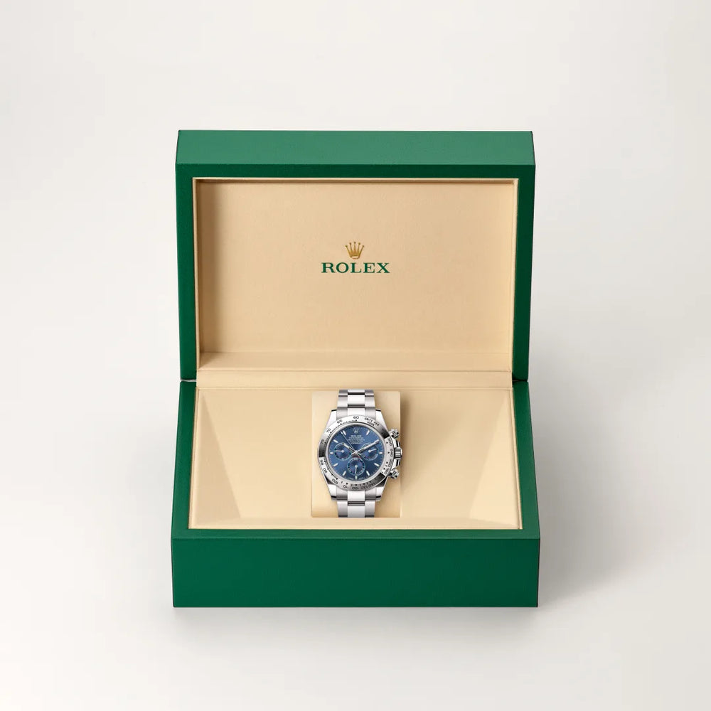 Rolex Cosmograph Daytona in 18 ct white gold with a Bright blue dial, Fixed, with engraved tachymetric scale, in 18 ct white gold bezel, Oyster, three-piece solid links bracelet