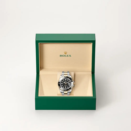 Rolex Sea-Dweller in Yellow Rolesor - combination of Oystersteel and yellow gold with a Intense black dial, Unidirectional rotatable 60-minute graduated, scratch-resistant Cerachrom insert in black ceramic, numerals and graduations coated in gold bezel, Oyster, three-piece solid links bracelet
