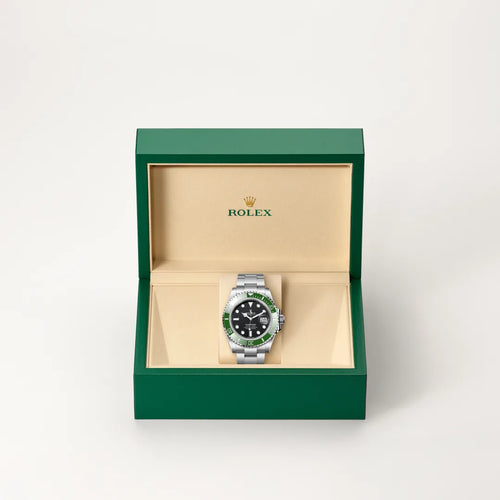 Rolex Submariner Date in Oystersteel with a Black dial, Unidirectional rotatable 60-minute graduated, scratch-resistant Cerachrom insert in green ceramic, numerals and graduations coated in platinum bezel, Oyster, three-piece solid links bracelet