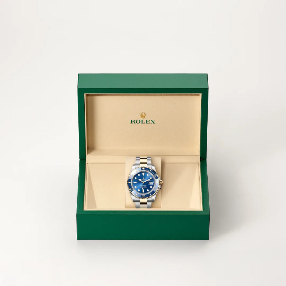Rolex Submariner Date in Yellow Rolesor - combination of Oystersteel and yellow gold with a Royal blue dial, Unidirectional rotatable 60-minute graduated, scratch-resistant Cerachrom insert in blue ceramic, numerals and graduations coated in gold bezel, Oyster, three-piece solid links bracelet