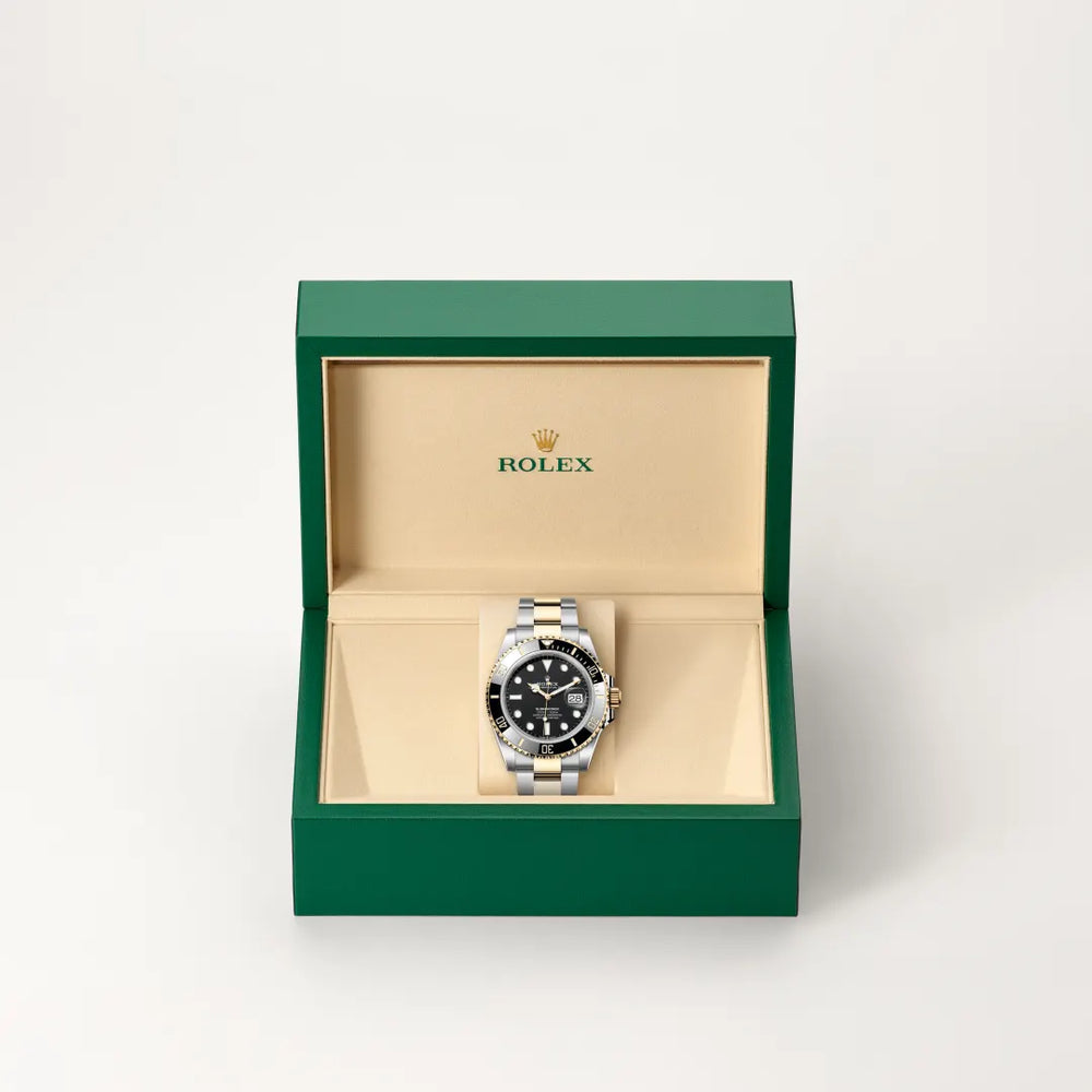 Rolex Submariner Date in Yellow Rolesor - combination of Oystersteel and yellow gold with a Black dial, Unidirectional rotatable 60-minute graduated, scratch-resistant Cerachrom insert in black ceramic, numerals and graduations coated in gold bezel, Oyster, three-piece solid links bracelet
