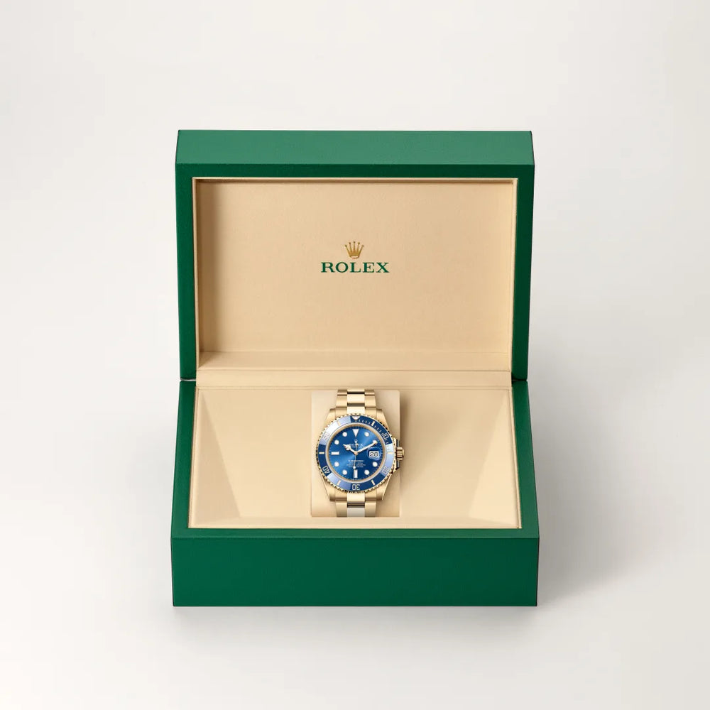 Rolex Submariner Date in 18 ct yellow gold with a Royal blue dial, Unidirectional rotatable 60-minute graduated, scratch-resistant Cerachrom insert in blue ceramic, numerals and graduations coated in gold bezel, Oyster, three-piece solid links bracelet