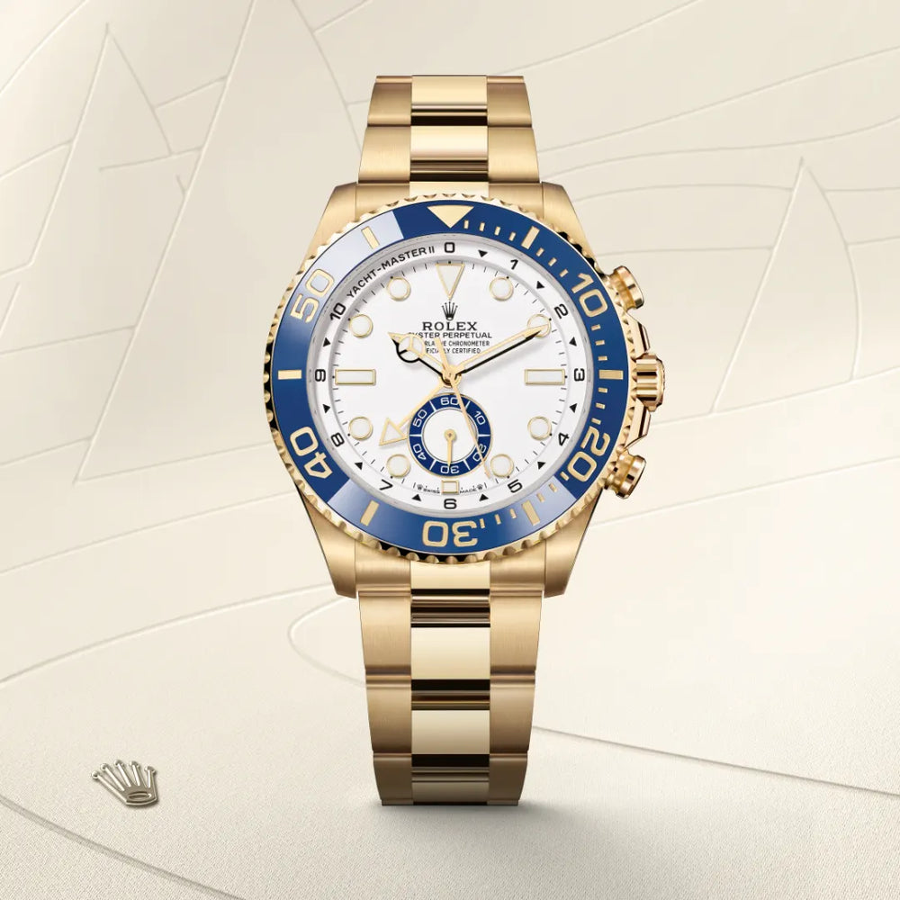 Rolex Yacht-Master II in 18 ct yellow gold with a White dial, Bidirectional rotatable 60-minute graduated bezel with blue Cerachrom insert in ceramic. Moulded, recessed graduations and numerals coated with gold bezel, Oyster, three-piece solid links bracelet