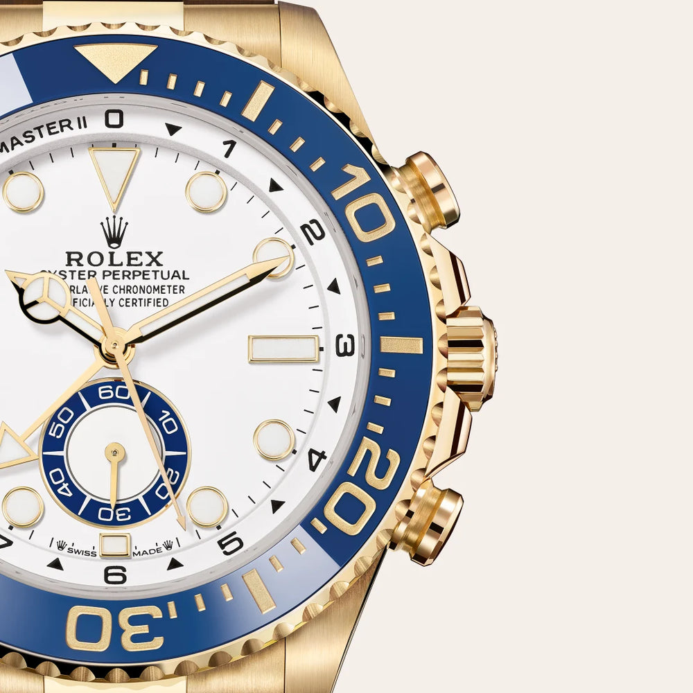 Rolex Yacht-Master II in 18 ct yellow gold with a White dial, Bidirectional rotatable 60-minute graduated bezel with blue Cerachrom insert in ceramic. Moulded, recessed graduations and numerals coated with gold bezel, Oyster, three-piece solid links bracelet