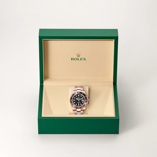 Rolex GMT-Master II in 18 ct Everose gold with a Black dial, Bidirectional rotatable 24-hour graduated bezel. Two-colour brown and black Cerachrom insert in ceramic, moulded numerals and graduations bezel, Oyster, three-piece solid links bracelet