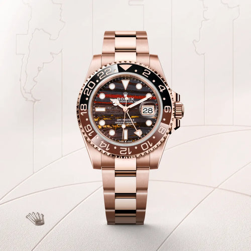 Rolex GMT-Master II in 18 ct Everose gold with a Tiger iron dial, Bidirectional rotatable 24-hour graduated bezel. Two-colour brown and black Cerachrom insert in ceramic, moulded numerals and graduations bezel, Oyster, three-piece solid links bracelet
