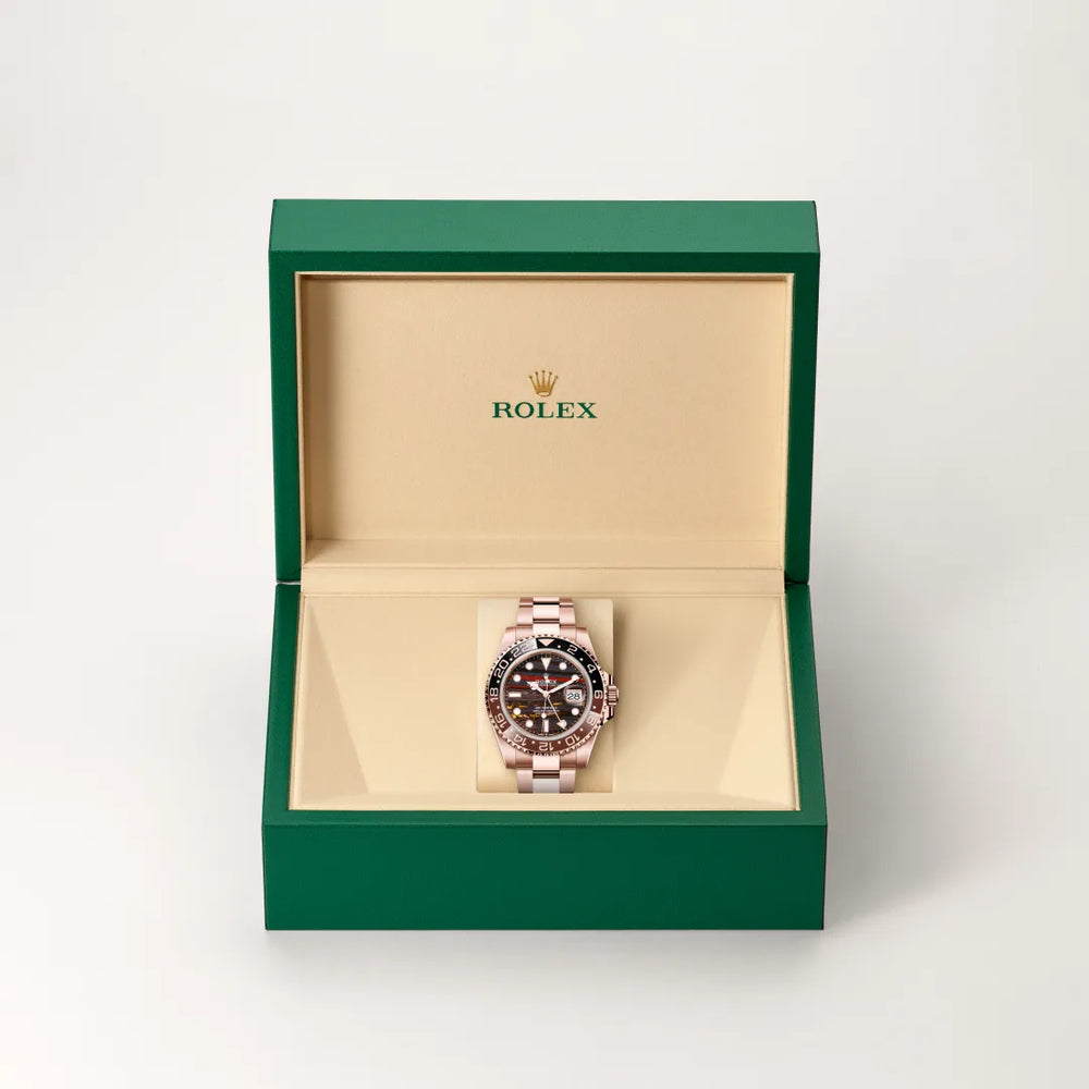 Rolex GMT-Master II in 18 ct Everose gold with a Tiger iron dial, Bidirectional rotatable 24-hour graduated bezel. Two-colour brown and black Cerachrom insert in ceramic, moulded numerals and graduations bezel, Oyster, three-piece solid links bracelet