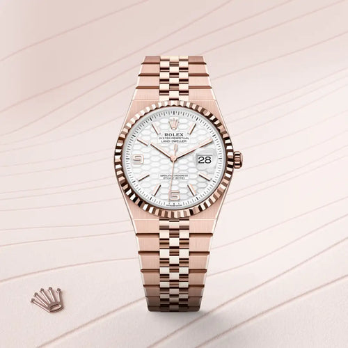Rolex Land-Dweller 36 in 18 ct Everose gold with a Intense white, honeycomb motif dial, Fluted bezel, Flat Jubilee, five-piece solid links bracelet