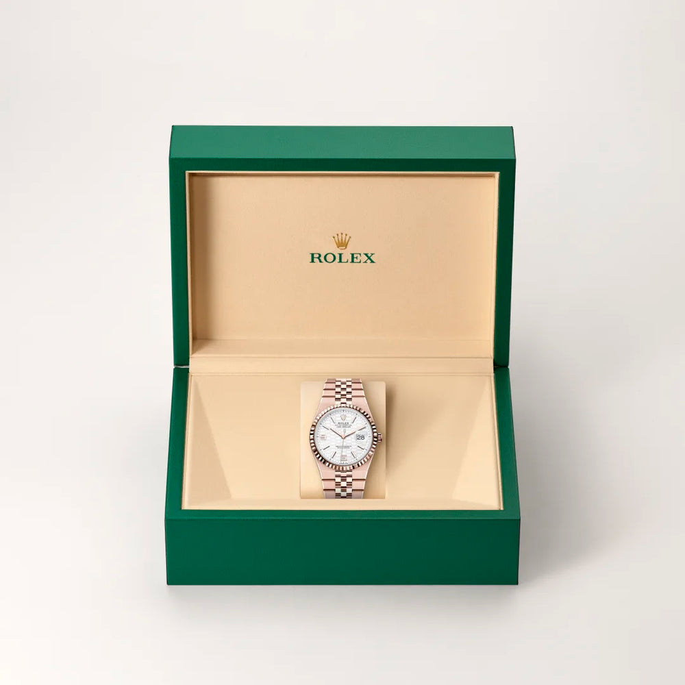 Rolex Land-Dweller 36 in 18 ct Everose gold with a Intense white, honeycomb motif dial, Fluted bezel, Flat Jubilee, five-piece solid links bracelet