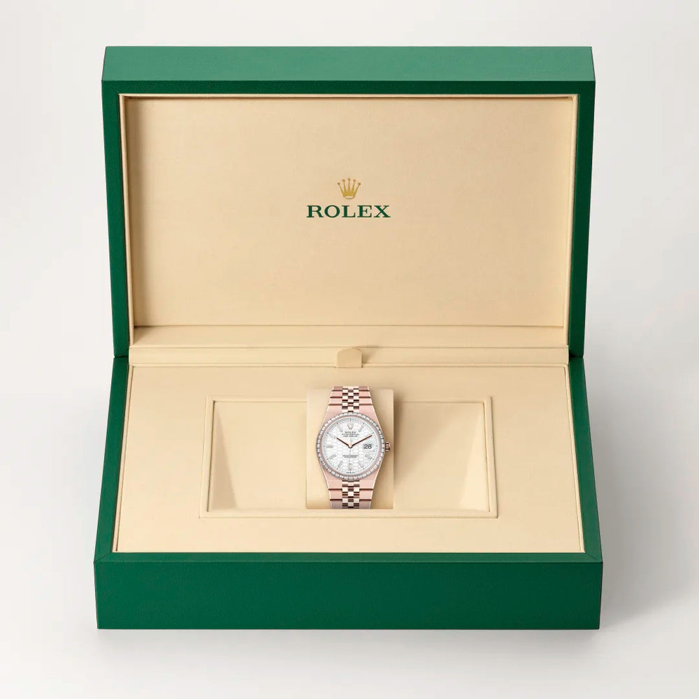 Rolex Land-Dweller 36 in 18 ct Everose gold with a Intense white, honeycomb motif set with diamonds dial, Set with diamonds bezel, Flat Jubilee, five-piece solid links bracelet