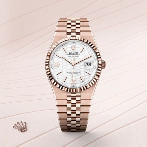 Rolex Land-Dweller 40 in 18 ct Everose gold with a Intense white, honeycomb motif dial, Fluted bezel, Flat Jubilee, five-piece solid links bracelet