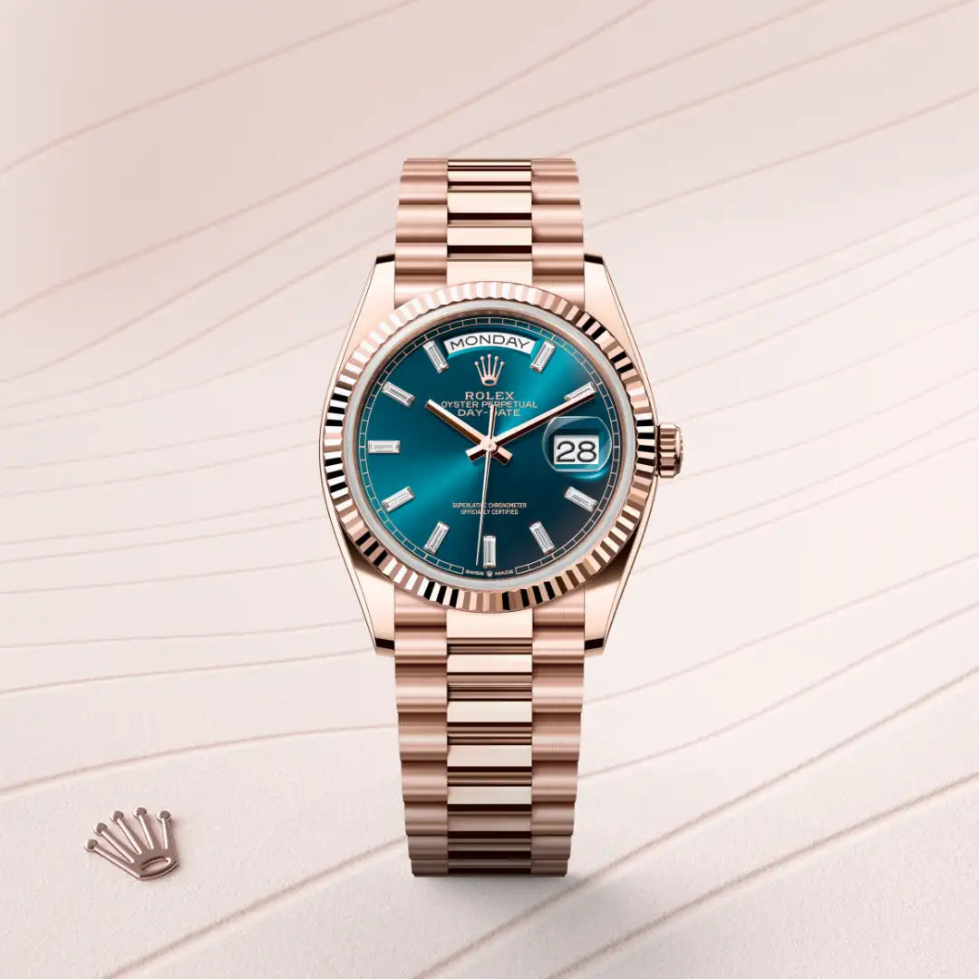 Rolex Day-Date 36 in 18 ct Everose gold with a Blue-green set with diamonds dial, Fluted bezel, President, semi-circular three-piece links bracelet
