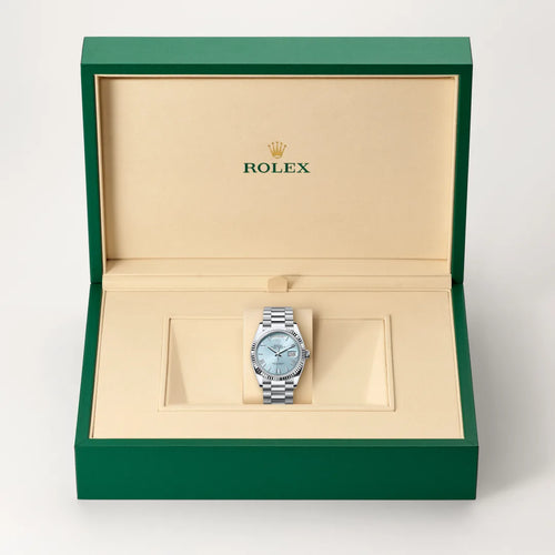 Rolex Day-Date 36 in Platinum with a Ice blue dial, Fluted bezel, President, semi-circular three-piece links bracelet