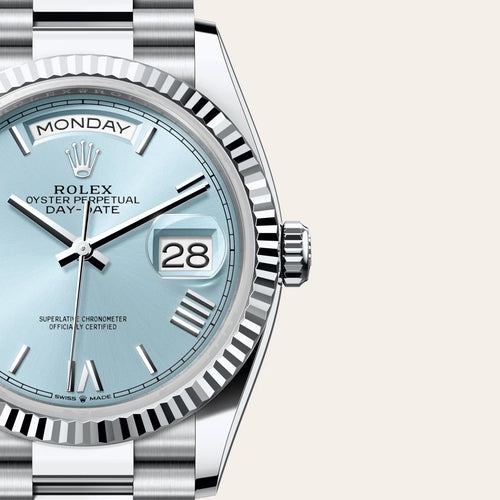 Rolex Day-Date 36 in Platinum with a Ice blue dial, Fluted bezel, President, semi-circular three-piece links bracelet