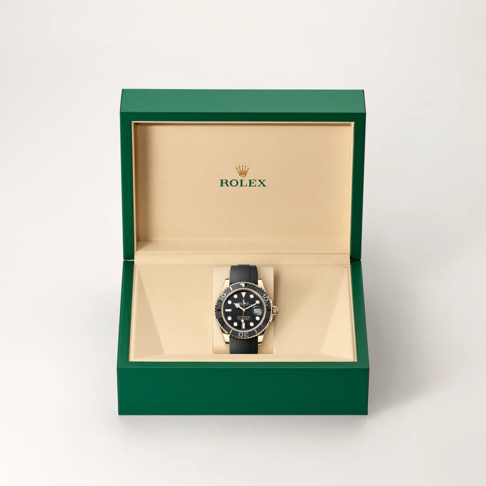 Rolex Yacht-Master 42 in 18 ct yellow gold with a Black dial, Bidirectional rotatable 60-minute graduated bezel with matt black Cerachrom insert in ceramic, polished raised numerals and graduations bezel, Oysterflex bracelet