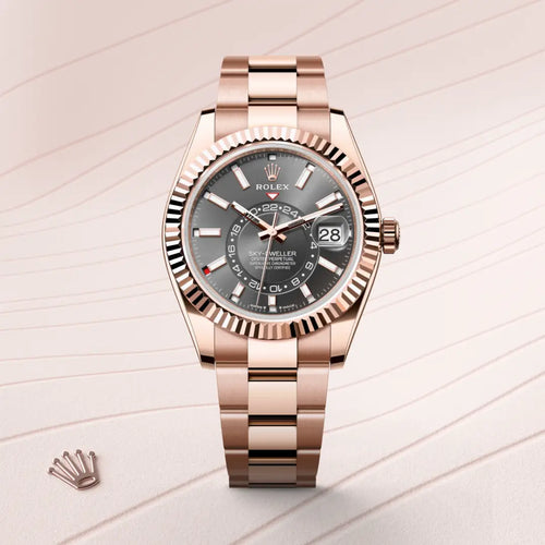 Rolex Sky-Dweller in 18 ct Everose gold with a Slate dial, Fluted, bidirectional rotatable Rolex Ring Command bezel, Oyster, three-piece solid links bracelet