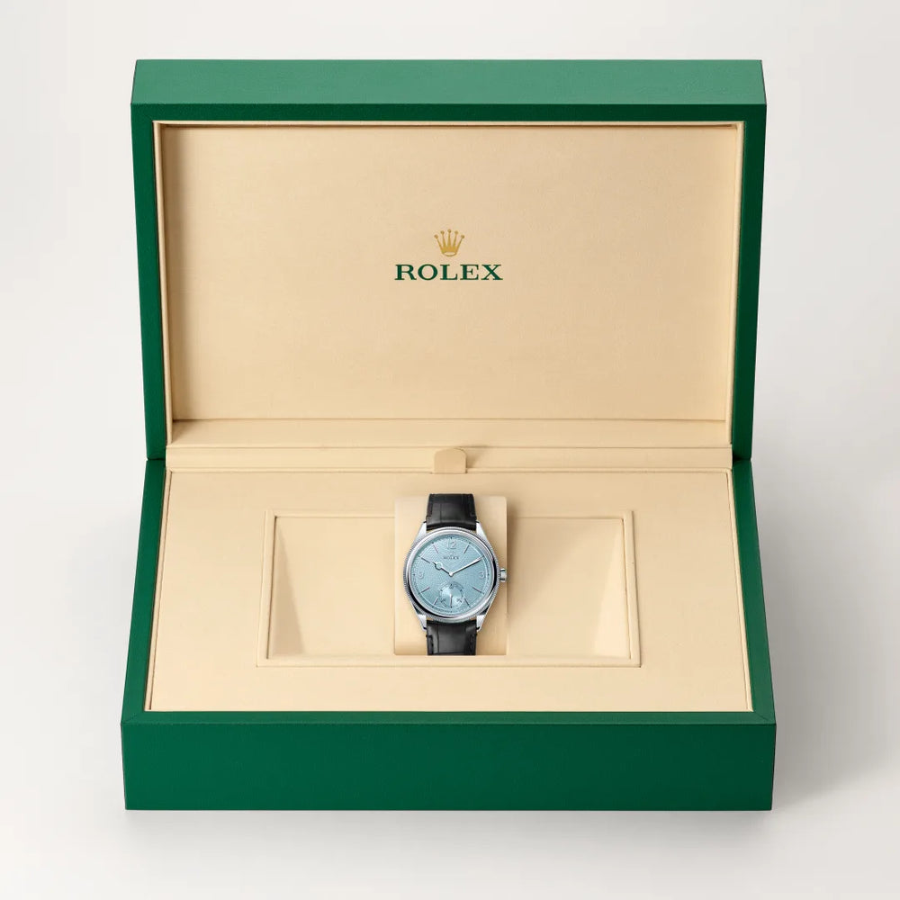 Rolex 1908 in Platinum with a Ice blue, rice-grain motif dial, Domed and fluted bezel, Leather strap bracelet