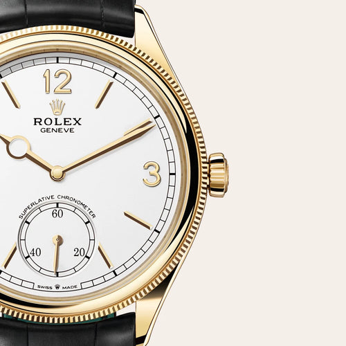 Rolex 1908 in 18 ct yellow gold with a Intense white dial, Domed and fluted bezel, Leather strap bracelet