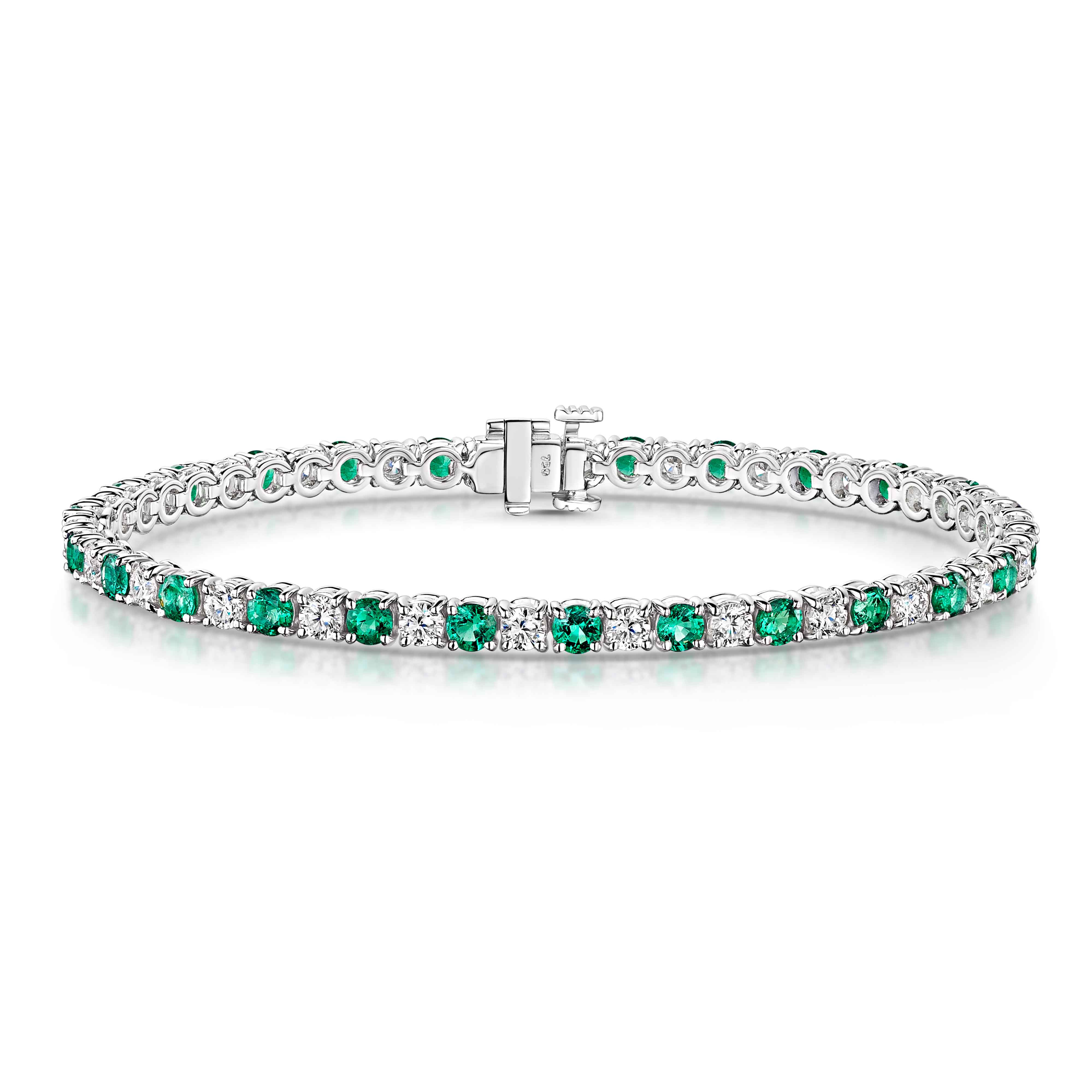 18ct White Gold Oval Emerald and Diamond Line Bracelet | Johnsons Jewellers